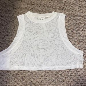 Lululemon size 2 white cropped see through tank top with designs.